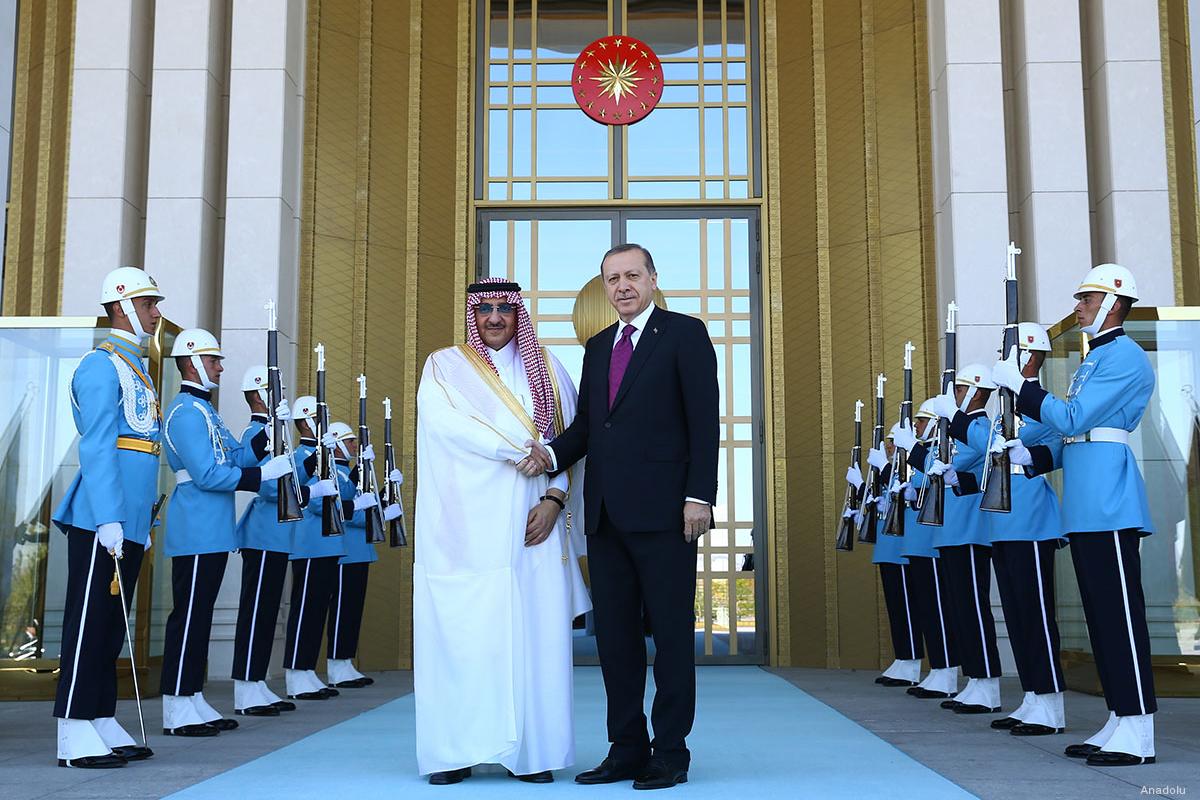 Turkish President Recep Tayyip Erdogan shakes hands with the Crown Prince of Saudi