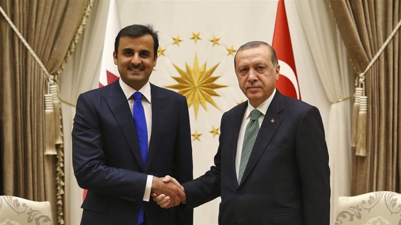 President Recep Tayyip Erdogan shakes hands with Sheikh Tamim bin Hamad Al Thani, the current Emir of Qatar